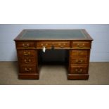 An Edwardian mahogany twin-pedestal writing desk.