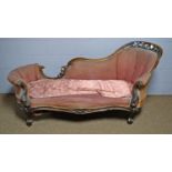 A Victorian carved and pierced walnut 'show frame' chaise longue.