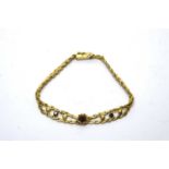 A sapphire set 18ct yellow gold bracelet,