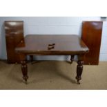 An early 20th Century walnut extending dining table.