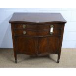 An early 20th Century mahogany serpentine fronted dining room cabinet.