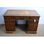 A Victorian-style mahogany pedestal desk.