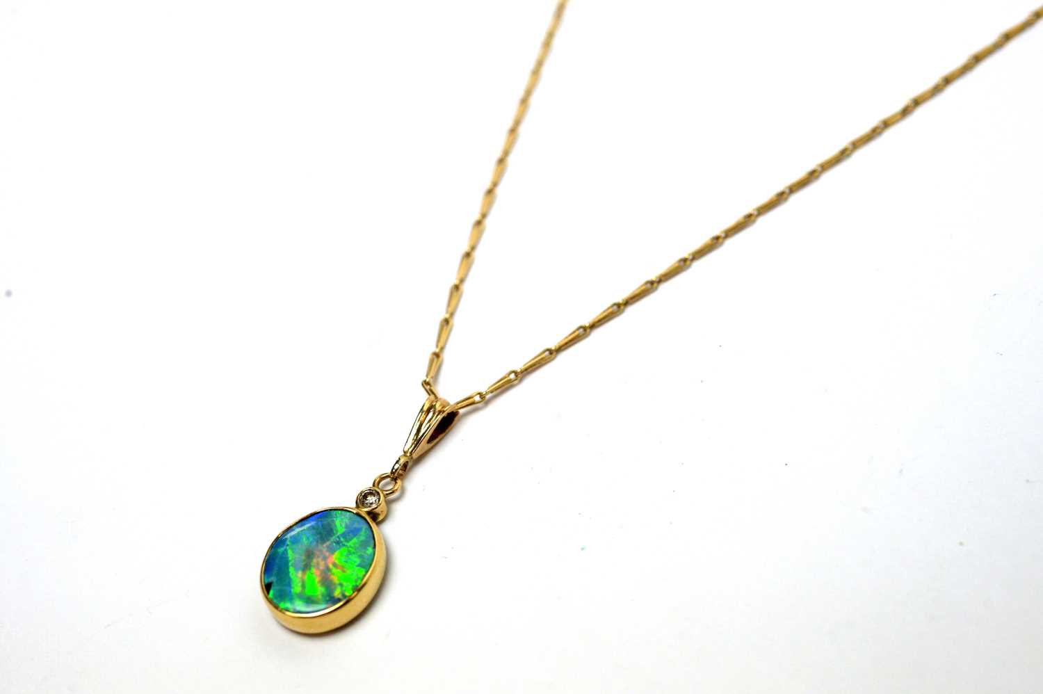 An opal and diamond pendant on chain. - Image 3 of 5