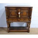 Attributed to Titchmarsh & Goodwin: a carved oak cocktail cabinet.