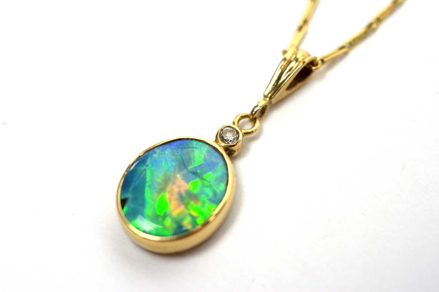 An opal and diamond pendant on chain. - Image 5 of 5