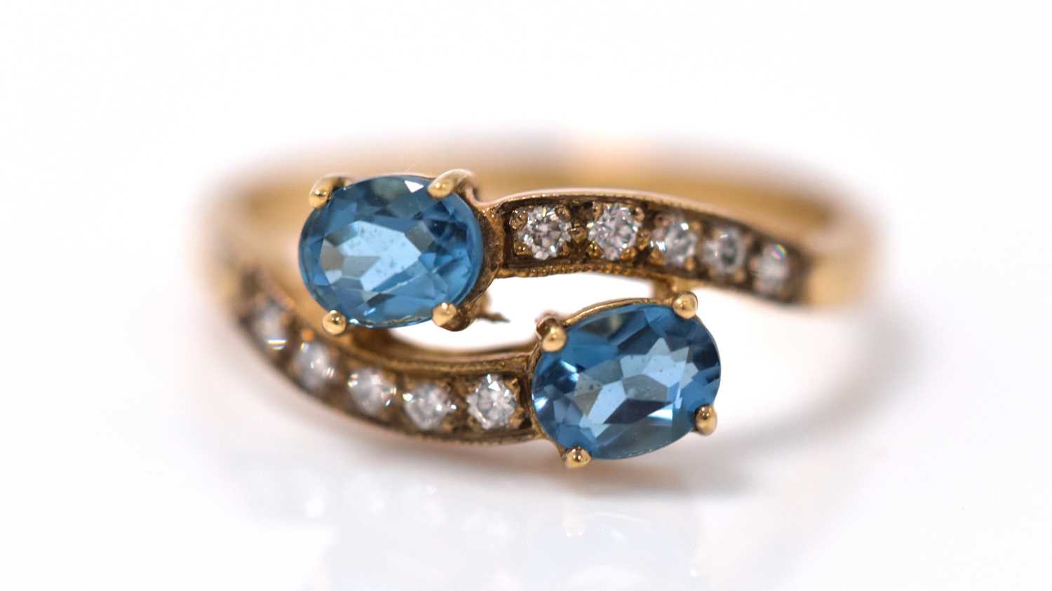 A topaz and diamond ring,