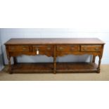 Attributed to Titchmarsh and Goodwin: an 18th Century style oak dresser.