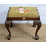 A Georgian-style mahogany stool.