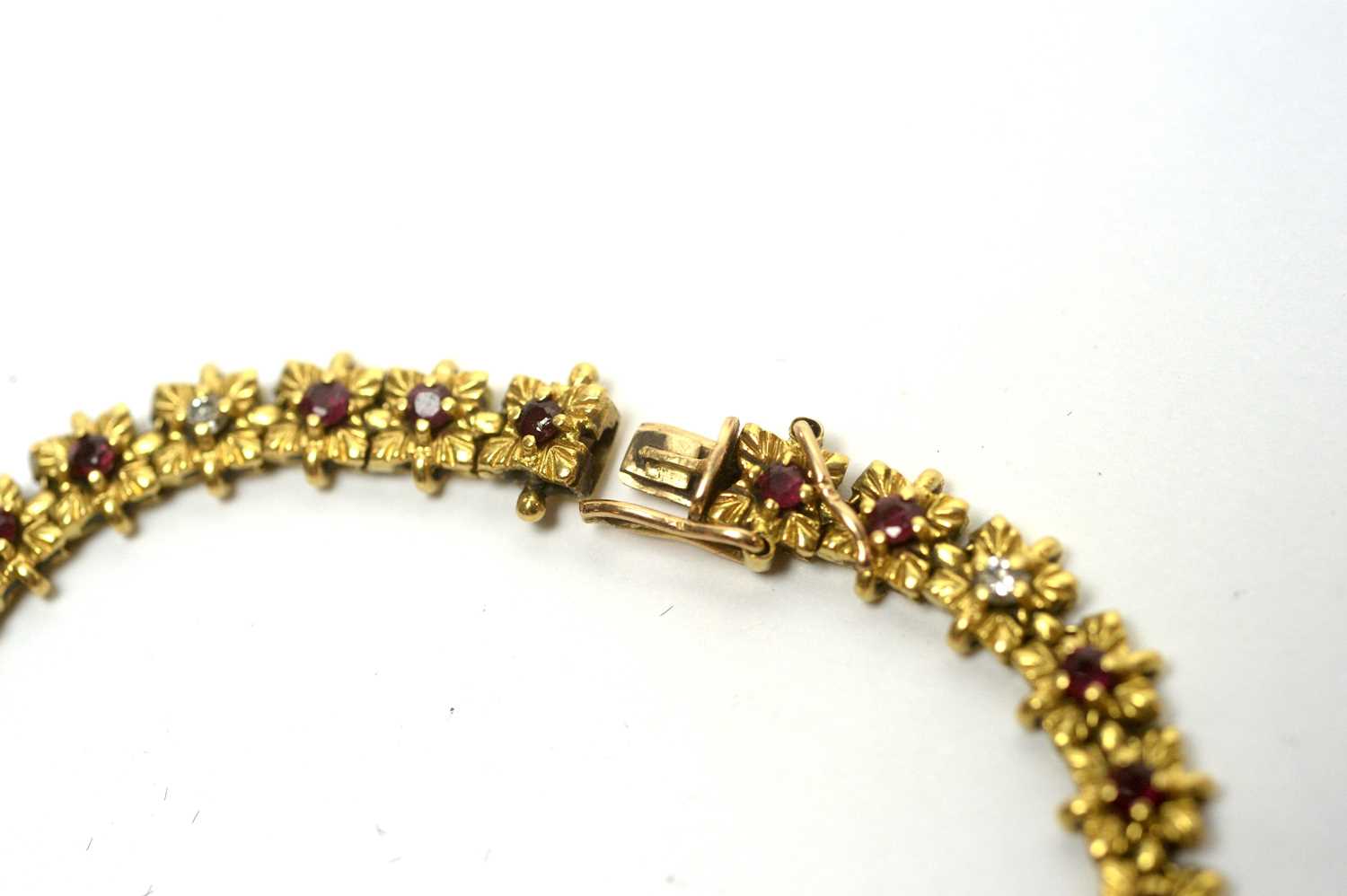 An 18ct yellow gold bracelet set with rubies and diamonds, - Image 3 of 3