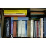 A selection of hardback and other books, primarily related to travel.