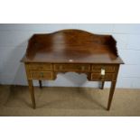 An early 20th Century mahogany and satinwood banded desk.