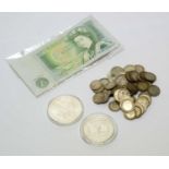 Two silver dollars and other coins and banknotes