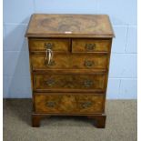 A small 18th Century style burr walnut chest.