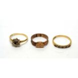 A 9ct yellow gold and plaited hair mourning ring and two other rings
