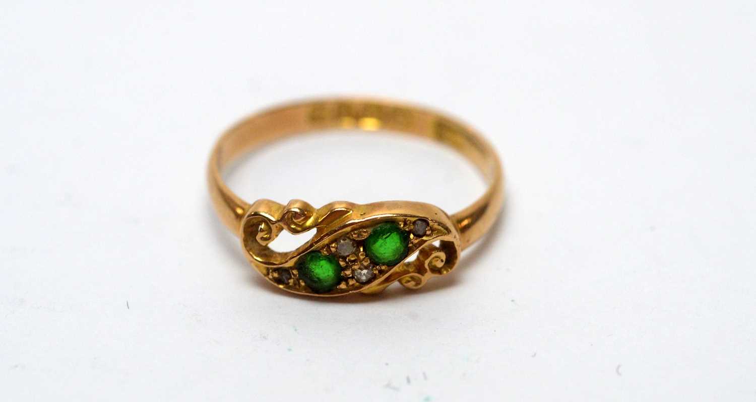 An emerald and diamond ring,