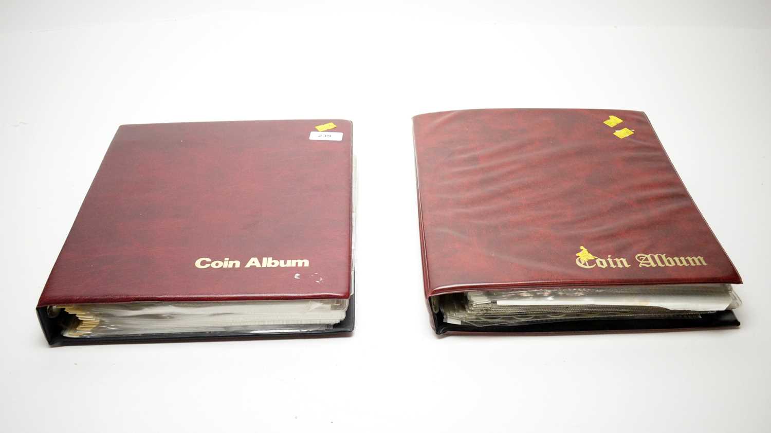 Two albums of world coins.