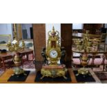 An French style cast, brass, bronzed and marble three-piece clock garniture by Lancini.
