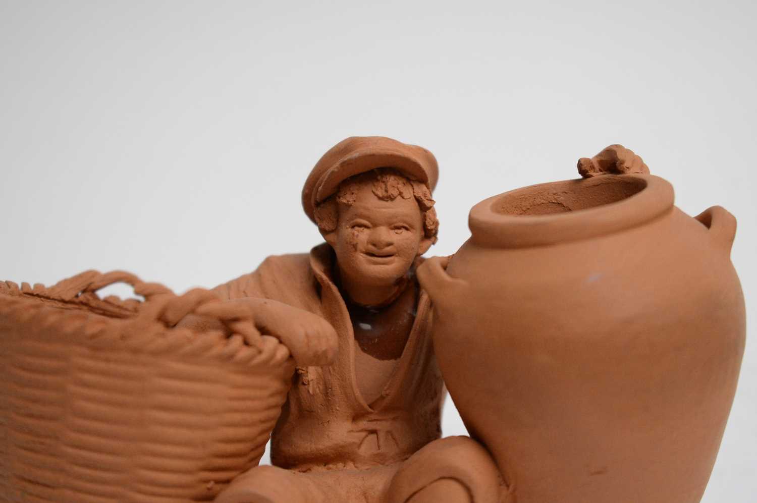A selection of decorative ceramic wares and terracotta figures. - Image 11 of 20