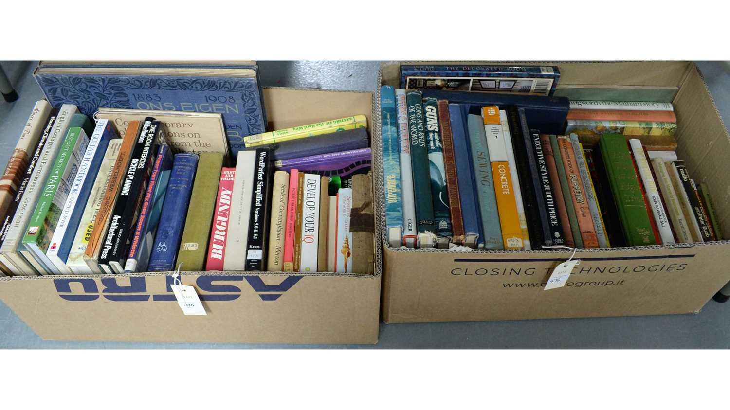 A selection of hardback and other books, contained across two boxes.