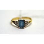 A diamond and blue stone dress ring