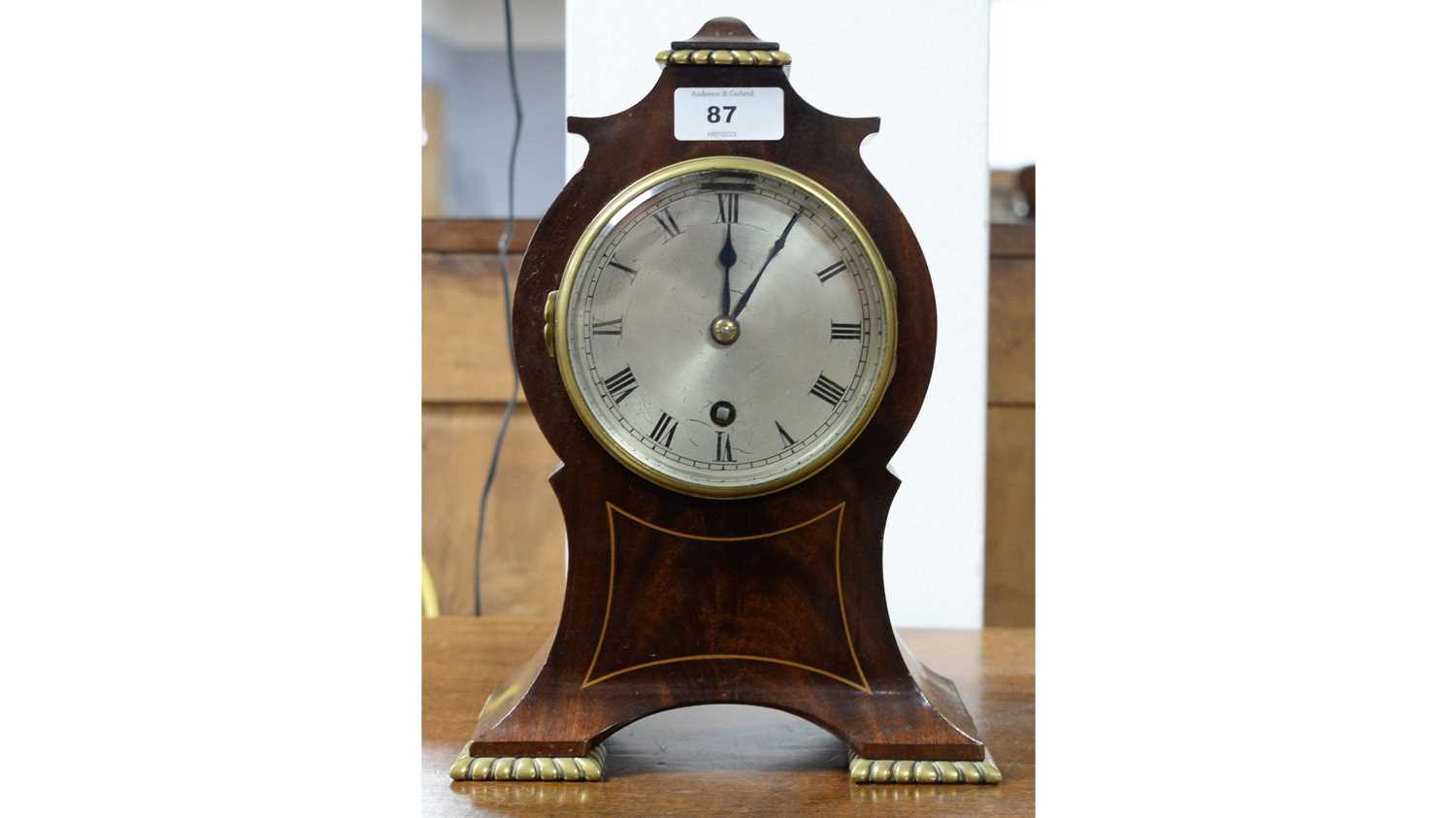 An early 20th Century mahogany timepiece.