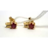 A pair of ruby and diamond stud earrings,