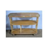 Ercol: a Windsor Model 361 beech and elm bookcase trolley.