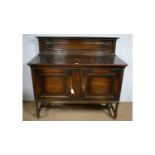 An early 20th Century oak sideboard.