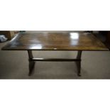 A rectangular oak plank top refectory dining table.