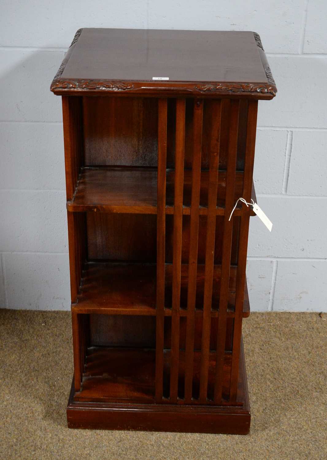 An Asian carved hardwood revolving bookcase in the Victorian style.