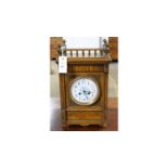 A late 19th Century carved oak mantel clock in the Aesthetic taste.