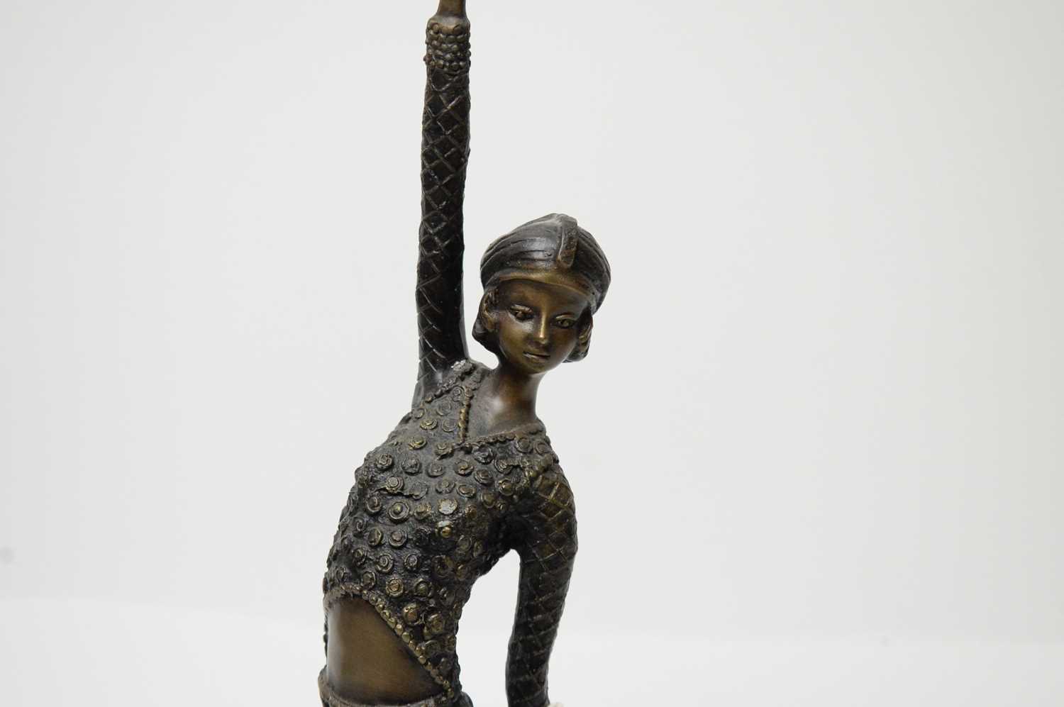 An Art Deco bronze figure of a dancer, modelled with one arm raised, 46cms high. - Image 2 of 2