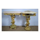 Two gold-painted and onyx cherub pattern corner/side tables.