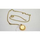 A George V gold sovereign in 9ct yellow gold brooch/pendant mount,