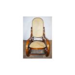 A Victorian-style bentwood and canework rocking chair.