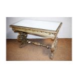 An ornate silver-painted Italian-style side table.