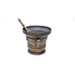 An impressive brass pestle and mortar