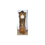 An unusual Vienna burr walnut clock.