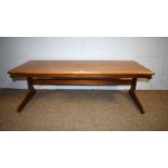 A mid Century teak coffee table.