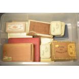 A collection of cigarette cards and tins.