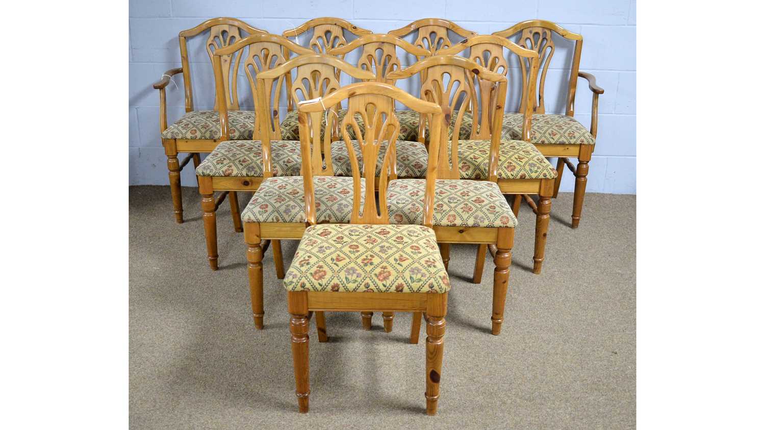 Ducal: a set of ten pine dining chairs (includes two carvers).