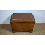 A Victorian mahogany sarcophagus-shaped wine cooler.