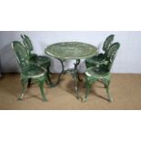 A green-painted cast metal garden table and four matching chairs.