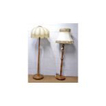 Two mid Century lamp standards; and a rococo-style table lamp.