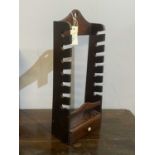 A 19th Century mahogany pipe rack.