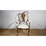 A late Victorian inlaid mahogany salon chair.