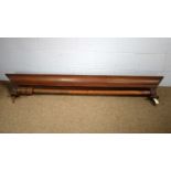 A Victorian mahogany curtain rail.