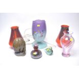A collection of decorative glass and ceramic wares.