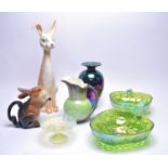 A collection of decorative lustrous ceramics and glass ware.