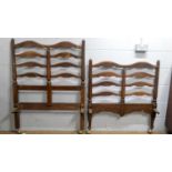 A pair of late 19th Century ladderback stained oak single bed ends.